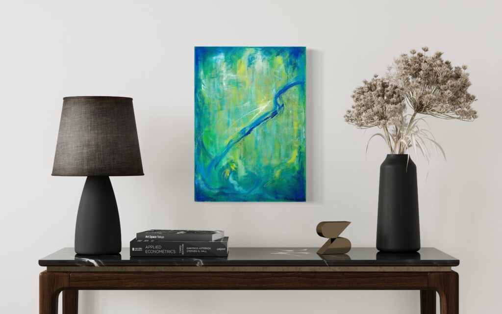 Abstract green and blue painting displayed on a wall above a modern black table with a lamp, vase, and books.